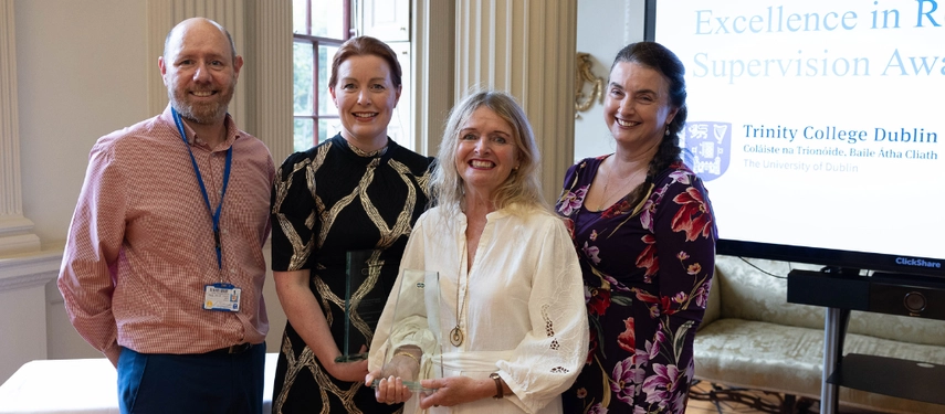 Colleagues support Prof Catherine Comiskey and Dr Mary Hughes as they receive awards for excellence
