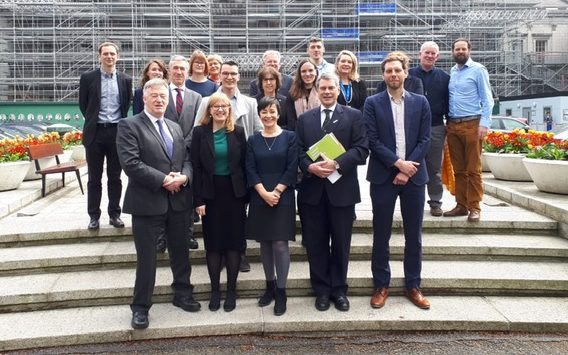 Panellists and members of staff from the Trinity Centre for Global Health with Chair of the Joint Committee on Health, Michael Harty, on the Plinth at Leinster House following the seminar on Access to Medicines for Non-communicable Diseases.