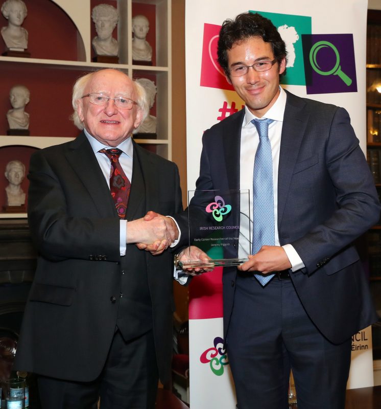 Dr Piggott receives his award from Ireland's President, Michael D Higgins.