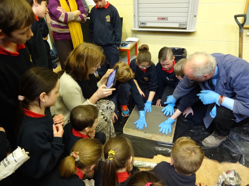 The winning team from St Oliver Plunkett National School leaving their hand-prints in one of the world’s most environmentally friendly concrete slabs ever made with Prof Roger West.