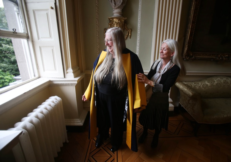 The seventh Ireland Chair of Poetry is robed by her predecessor, poet, Paula Meehan.