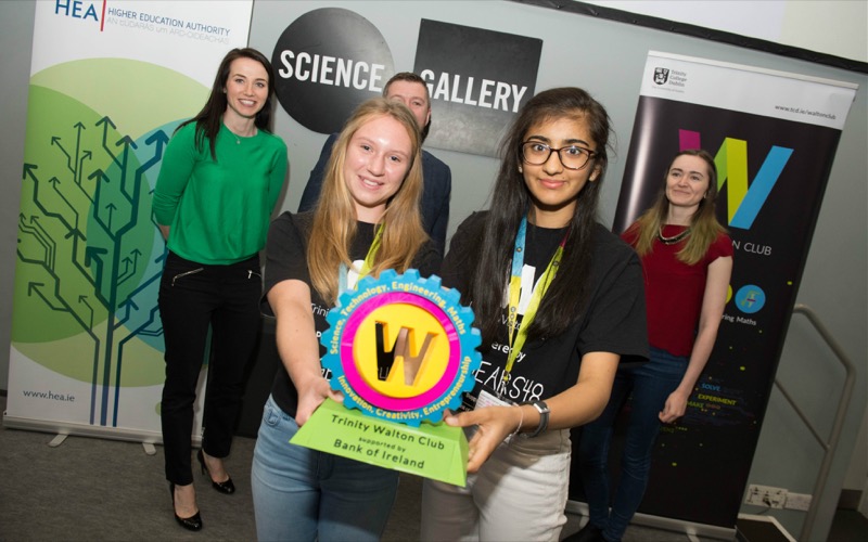 The winning team members collect their Ultimate Pitch Event trophy.