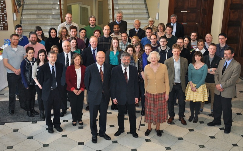 this photo was taken on the occasion of lady normanby's visit to the moyne institute in 2012, to observe the recently refurbished research laboratories. front row, left to right: lord normanby (son), charles dorman (professor of microbiology), lady normanby.