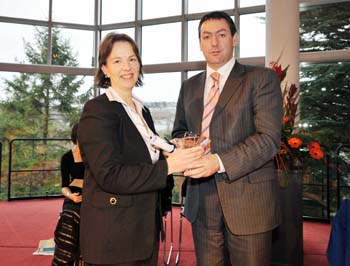 Professor sylvia draper being presented with her award by minister of state at the department of enterprise, trade and employment, billy kelleher 