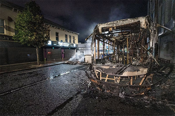 Image of burnt out bus in Belfast.