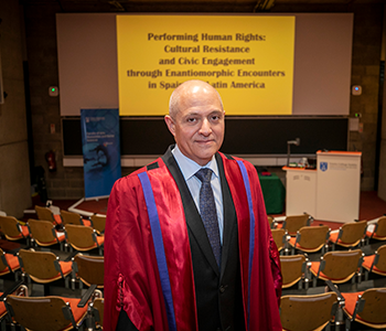 Professor Omar García in robes standing in a lecture theatre