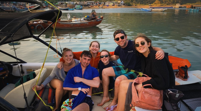 BESS student Daryl Egan with five friends on a boat in Hong Kong