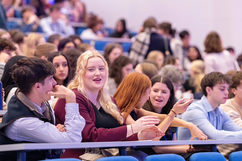 Trinity Laidlaw scholars sitting in a large auditorium at the Laidlaw Scholar Conference in London, 2026