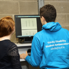 Two students looking at a computer