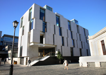 Side of Trinity Long Room Hub in bright sunshine and blue skies