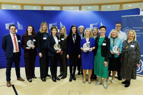 The TCD delegation pose for a photo with the EU-Horizon group with the award.