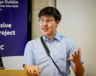 Trinity-INC Student Partner William Reynolds speaking at the Symposium
