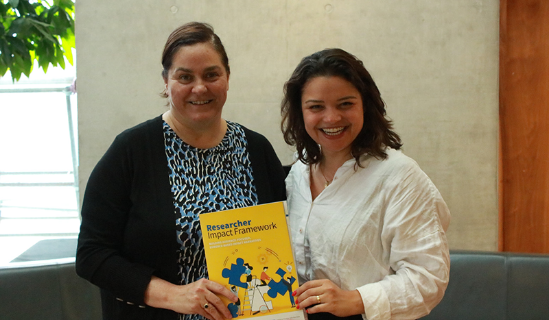 Sarah Bowman (L) and Giovanna Lima (R) launching the Research Impact Framework