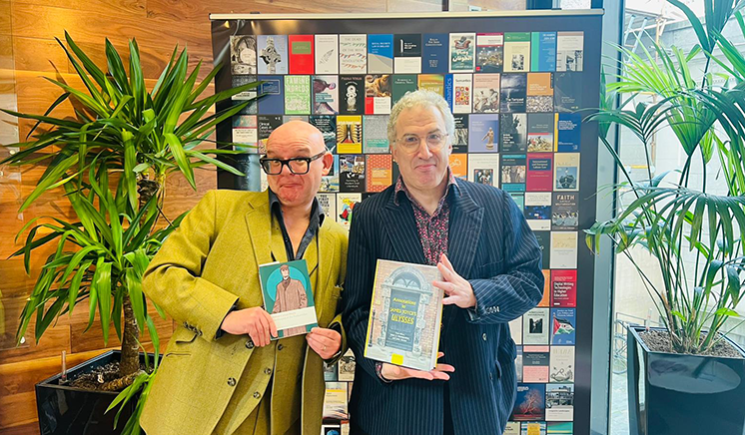 Sam Slote and Darryl Jones holding their books