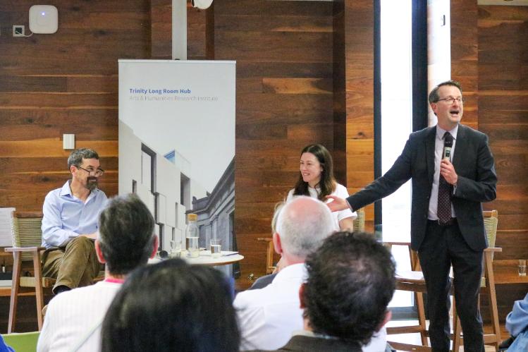 Patrick Geoghegan speaking at an event with Caitriona Lally and Colin Murphy
