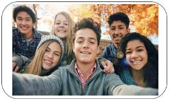 Group of teenagers smiling into the camera