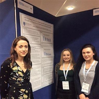 Lucy Kelly, (centre), with co-authors Niamh Aspell, IRC PhD candidate, (left) and Roisin Fitzgerald (right) pictured beside their research project poster