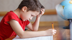 boy struggles to study