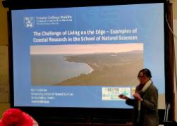 I. Moeller presents slide to the room