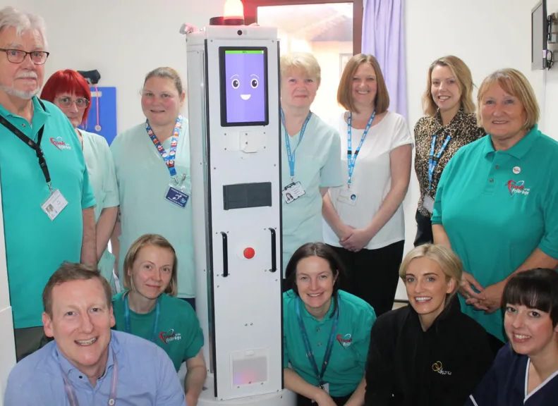 The Akara Robotics decontamination robot with clinical staff at Friarage Hospital.