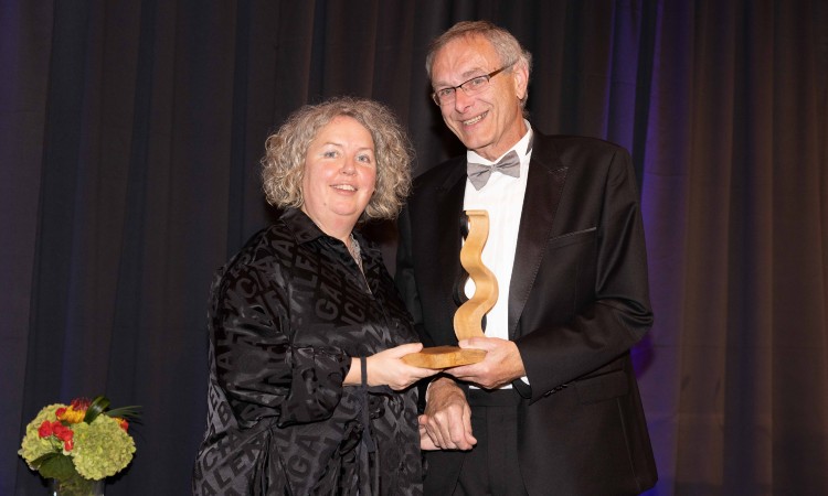 Provost Linda Doyle with David Duffy, holding his Alumni award