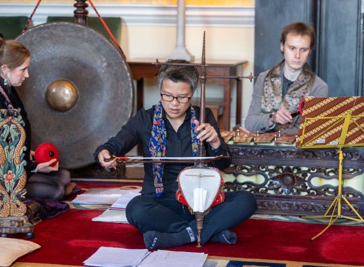 Asian man with instrument