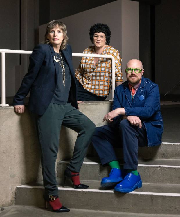 Three people in a stairwell