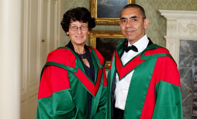 Man and woman in degree robes