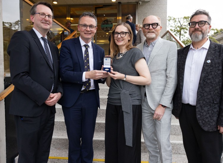 Group of people with a medal