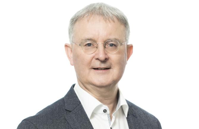 Headshot of man in suit