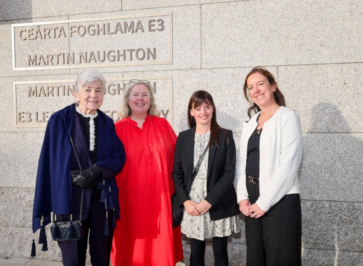 Four women pose in front of a sign that says Martin Naughton E3 Learning Foundry