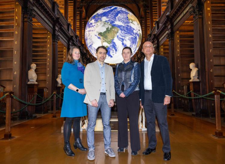 Team members pictured in front of ‘Gaia’ in Trinity College Dublin’s Long Room symbolising the commitment to understanding and preser ving the intricate connections within our world. (L - R) Chief Innovation and Enterprise Officer at TCD, Dr Michelle Olmstead ; Prof Marco Ruffini, CONNECT at TCD; Geraldine Moloney, ESB; Prof Hitesh Tewari, pictured in front of Gaia in the Old Library.