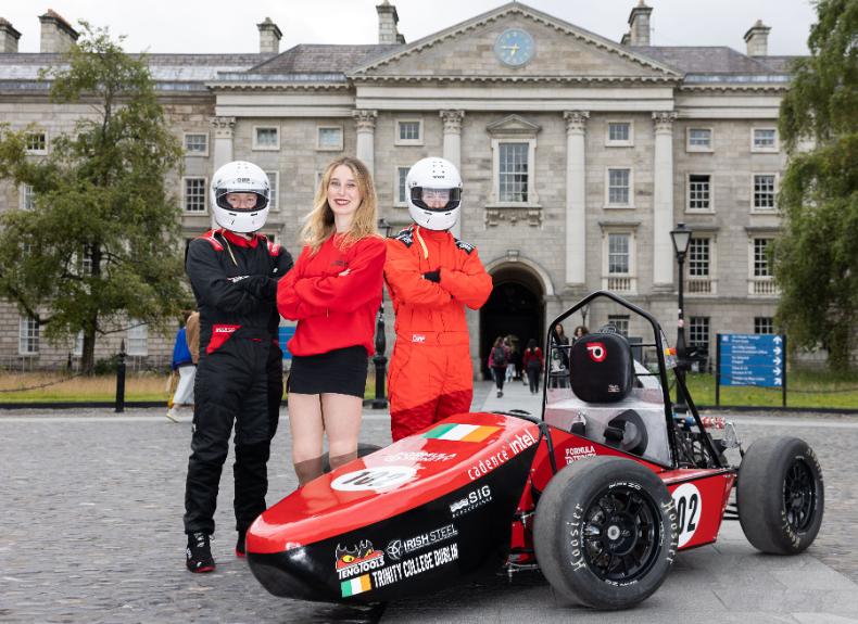 Formula Trinity team members, Adam Holmes, Katelyn Davis, and Michael Morgan with there new race car in Trinity's Front Square.
