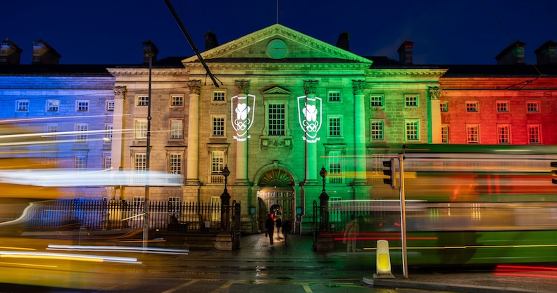 Trinity College Dublin lit up in the Olympic colours at night