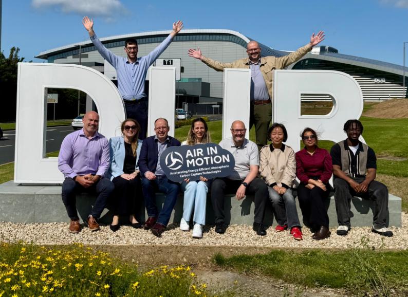 The AirinMotion and daa teams outside Dublin Airport on a sunny day.