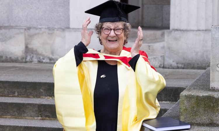 Mary Pyle pictured with her PhD thesis