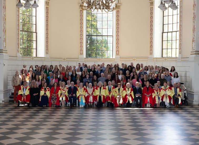 Large group pose in formal setting