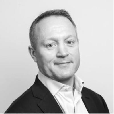 Professor Conor Buckley, in a head-and-shoulders profile shot. Conor is wearing a suit blazer and white shirt.