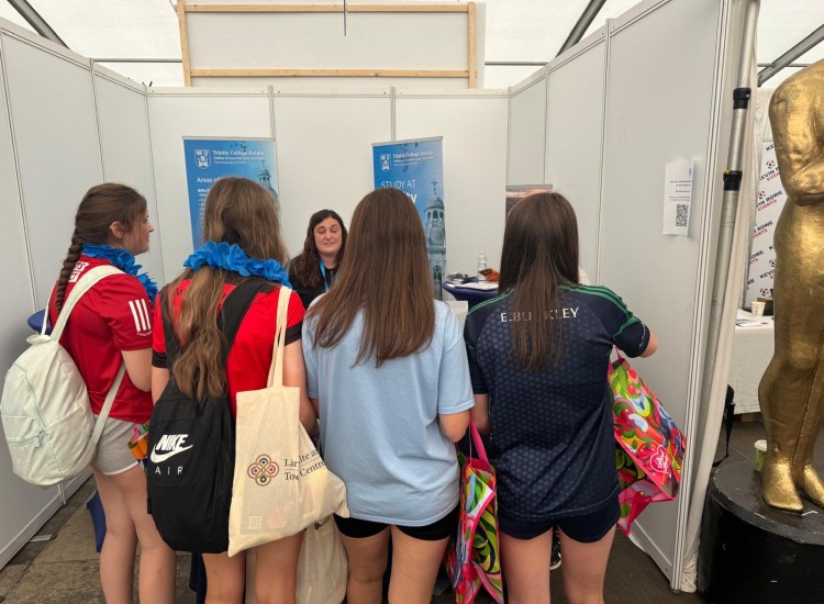 Teenage girls at a stand