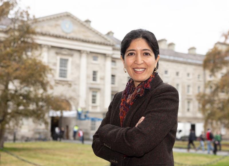 Prof Ruth Britto in Trinity's Front Square, wearing a dark jacket.