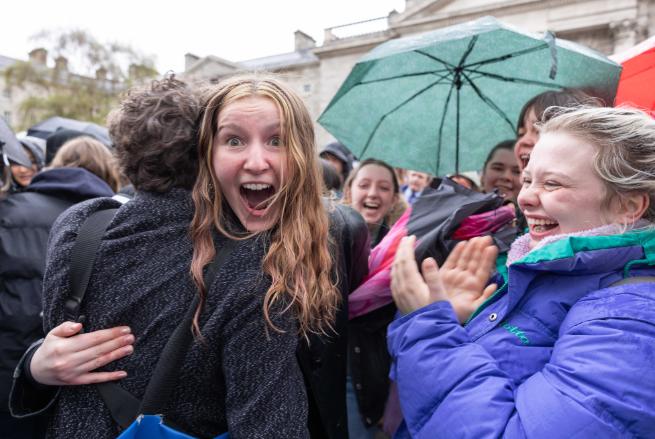 Ecstatic female student celebrates