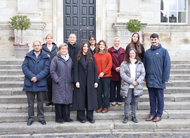 Researchers including Trinity's Prof. Nessa O'Connor stand on the Dining Hall steps at the launch of SEAGROW.