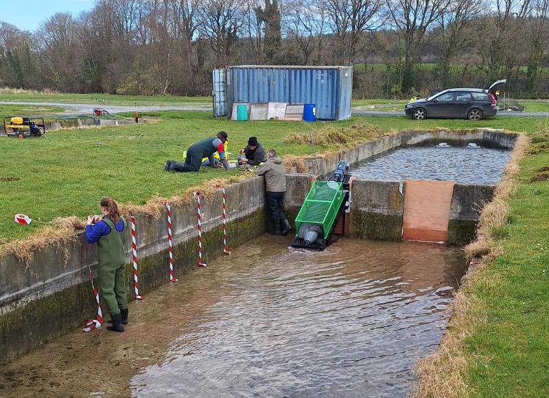 The Trinity and UCD team test the prototype unit in the field, at a river location where water is impacted by a barrier.
