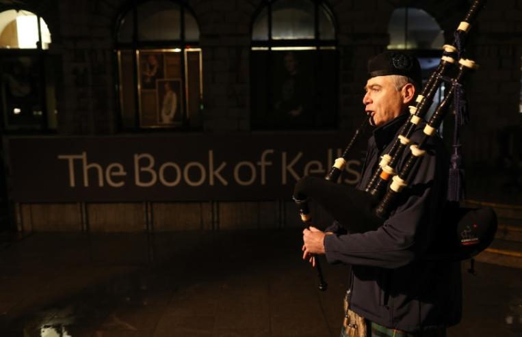 Bagpipers outside the book of kells