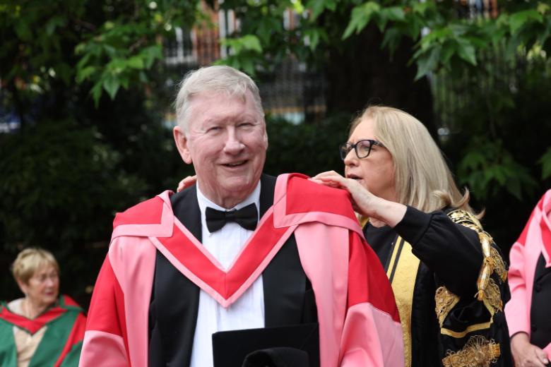 A man and a woman in academic robes