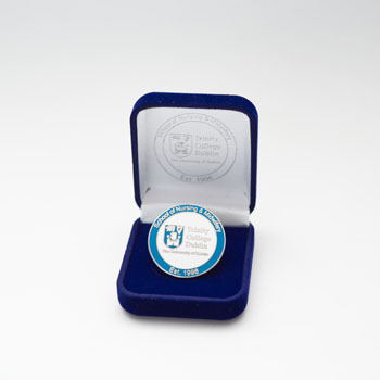 Graduate medal in presentation box on a white background