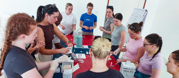 Students learning HIV Testing practice