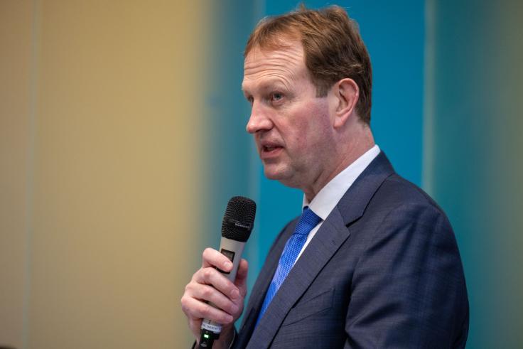 Jim O'Callaghan using microphone