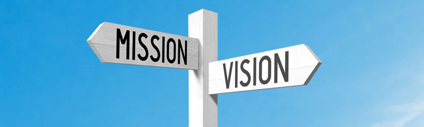 White wooden signpost/ crossroads sign with three arrows - mission, vision, values