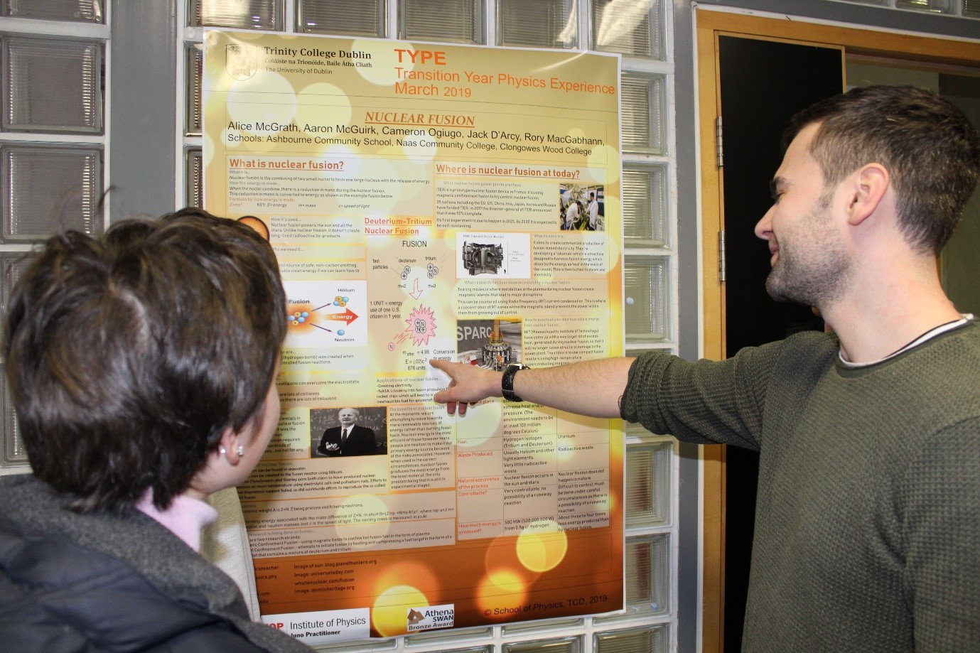 Students standing beside their poster who were runners up in the TYPE best content category